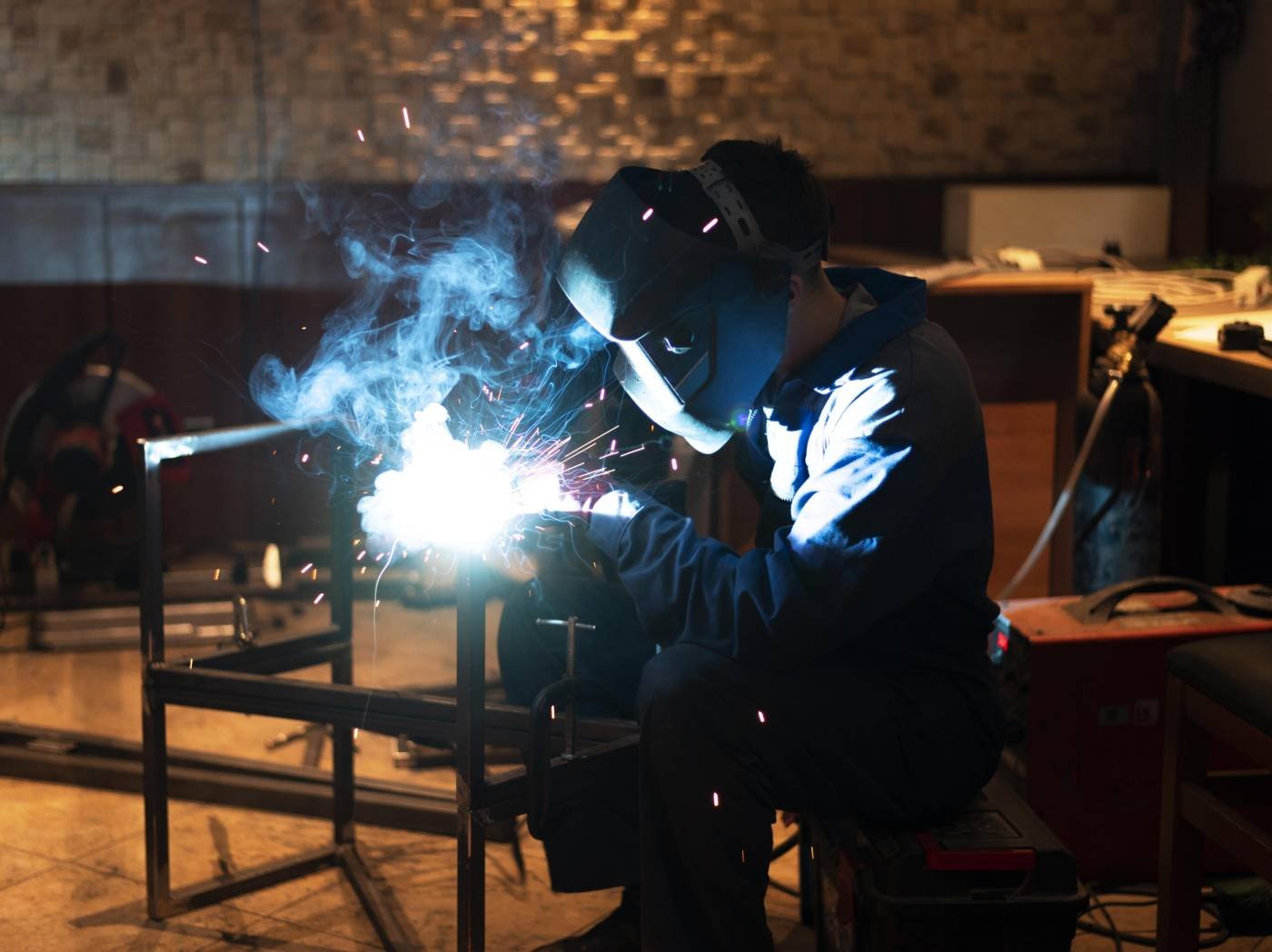 Man With Mask Welding Metal Atelier - DK Enterprise